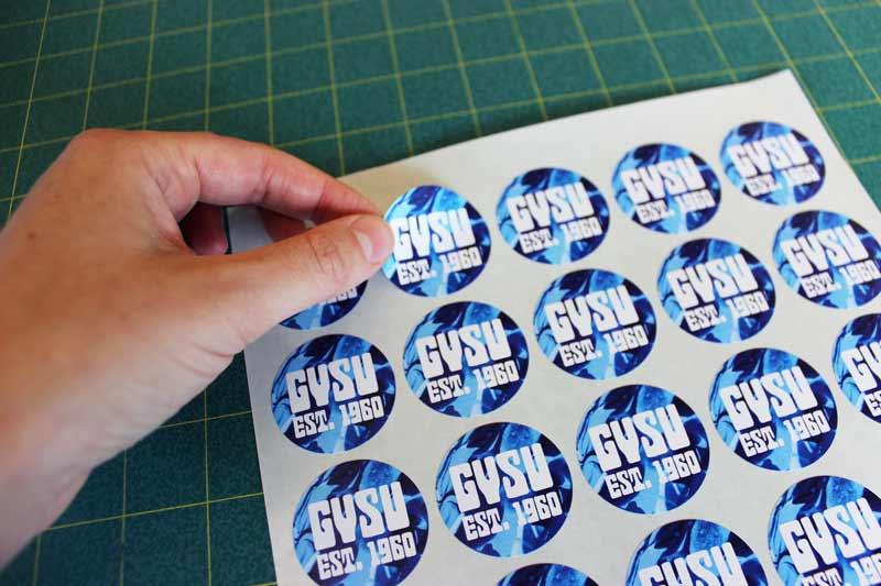 Sheet of GVSU stickers with one being peeled off